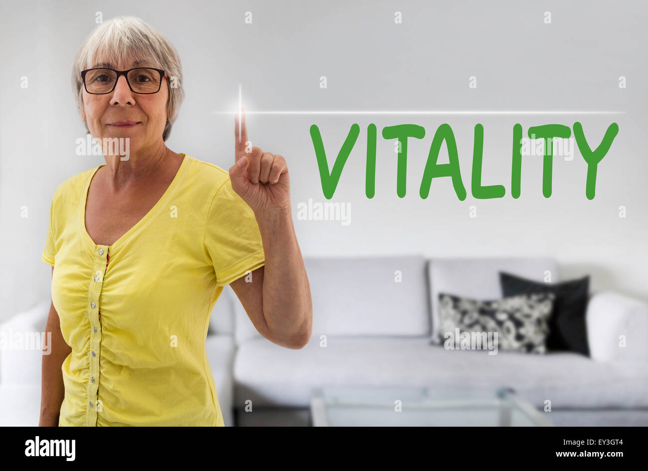 Vitality touchscreen is shown by senior. Stock Photo