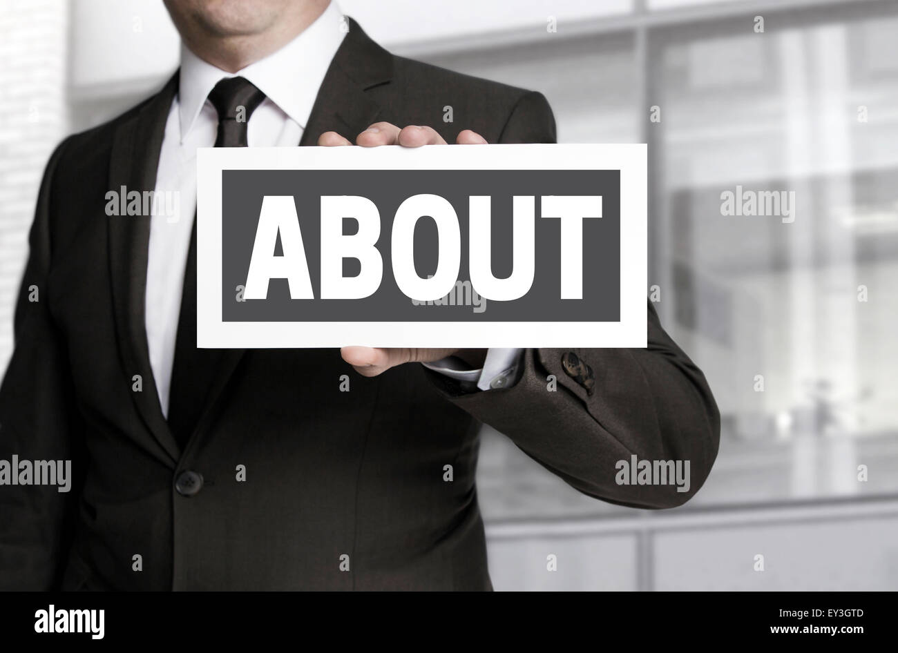 About sign held by businessman background. Stock Photo