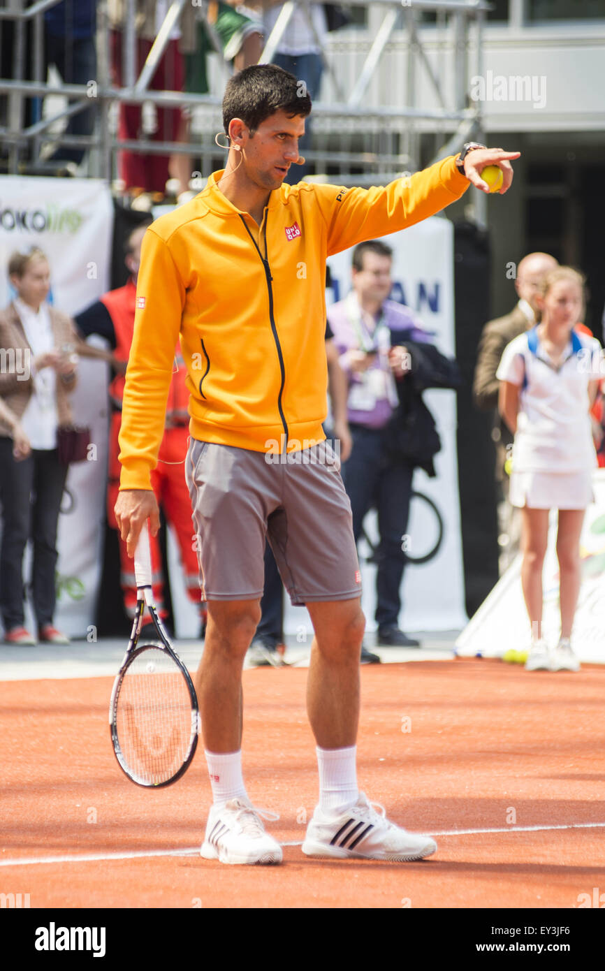 Novak Djokovic teaches young children how to play tennis in Lombardia City  Square Featuring: Novak Djokovic Where: Milan, Italy When: 18 May 2015  Stock Photo - Alamy