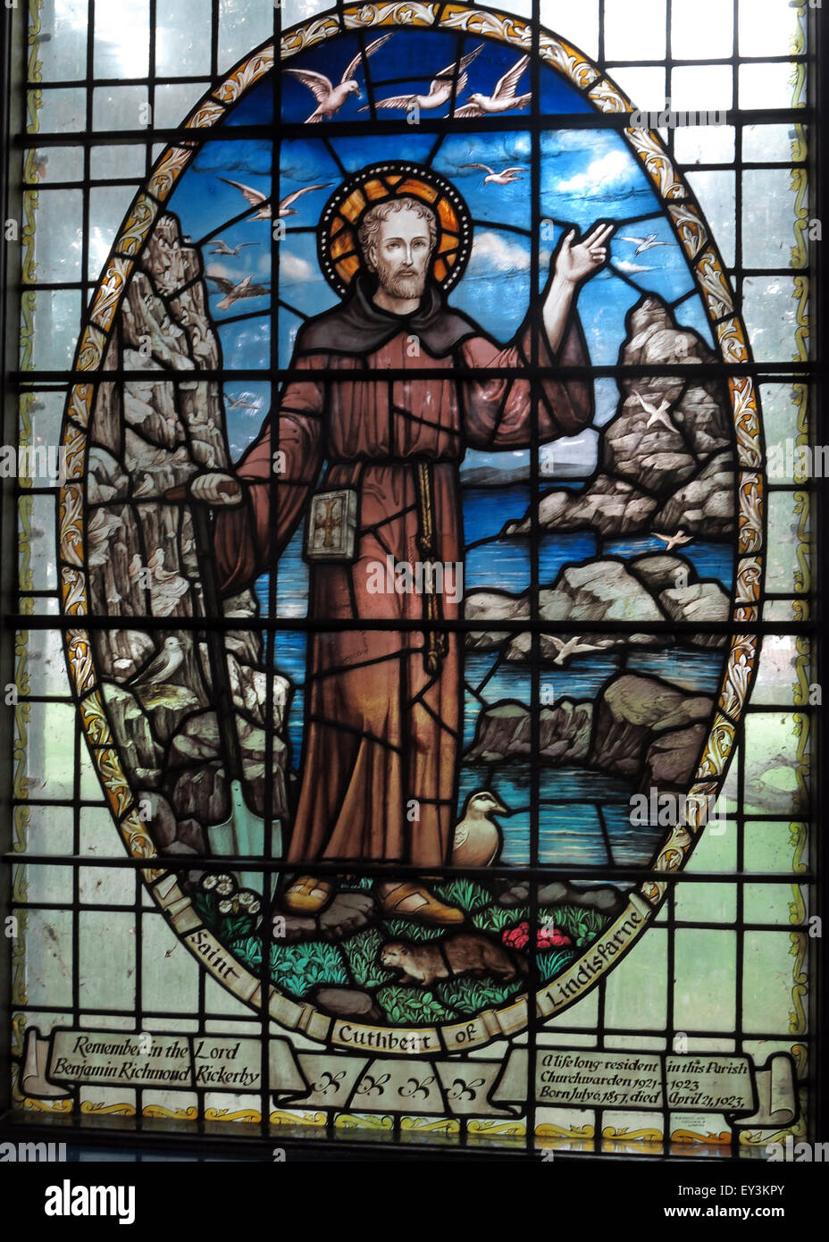 St Cuthberts Church,Carlisle,Cumbria,England,UK interior - Saint Cuthbert in a circle of stained glass Stock Photo