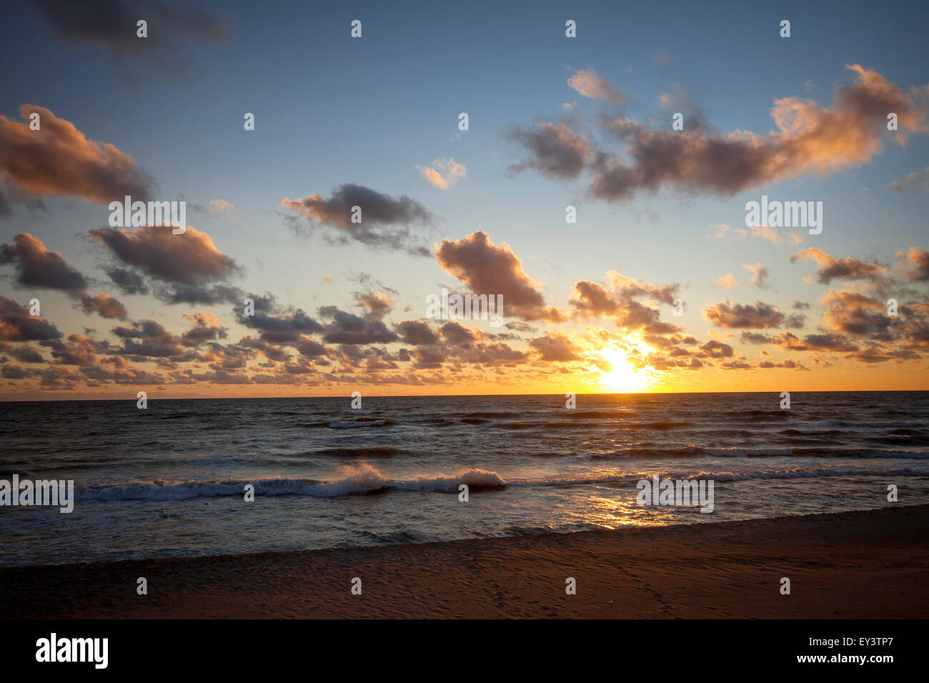 Beautiful sunset with clouds and sea Stock Photo - Alamy