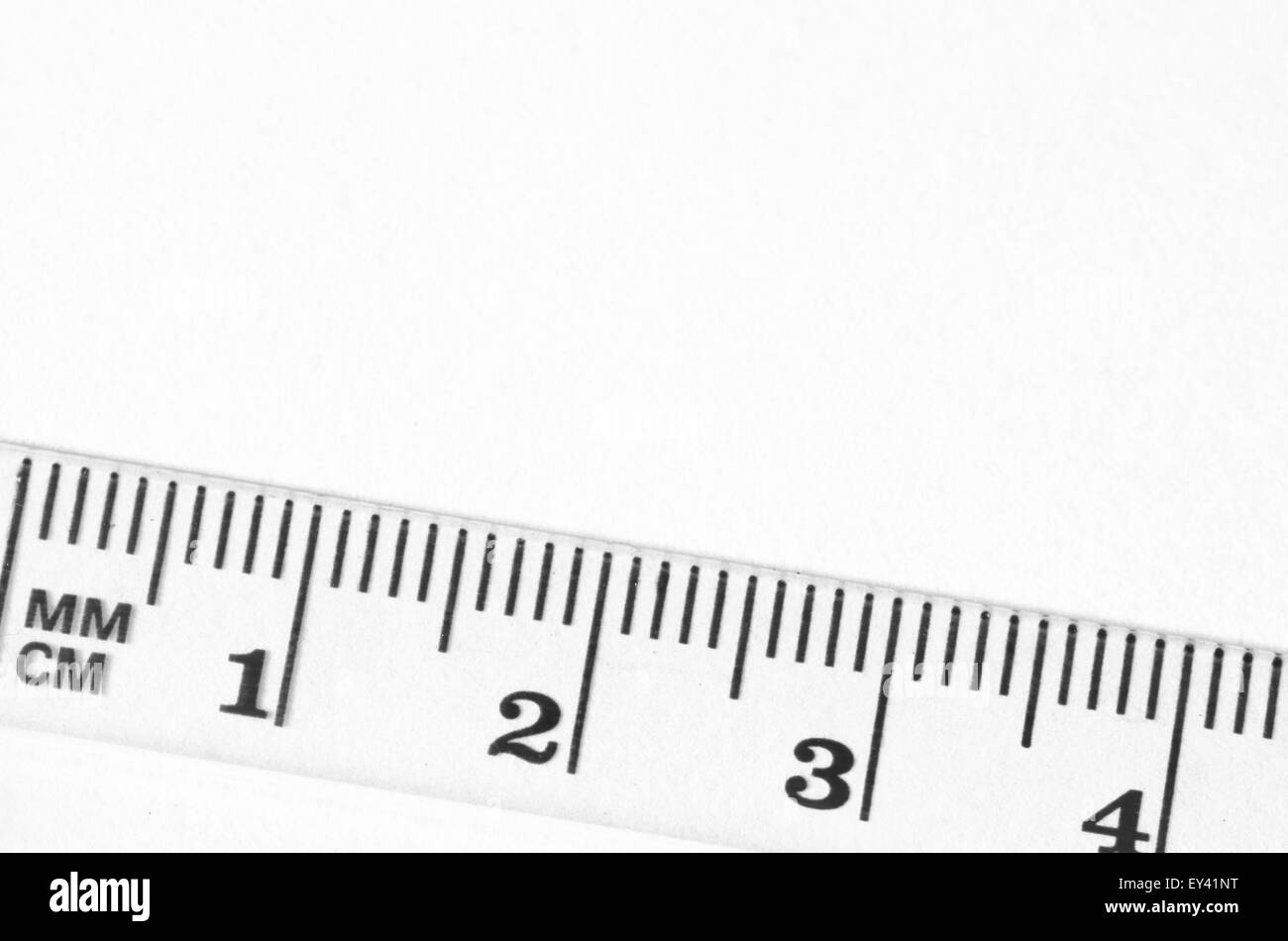 transparent ruler macro on paper background Stock Photo