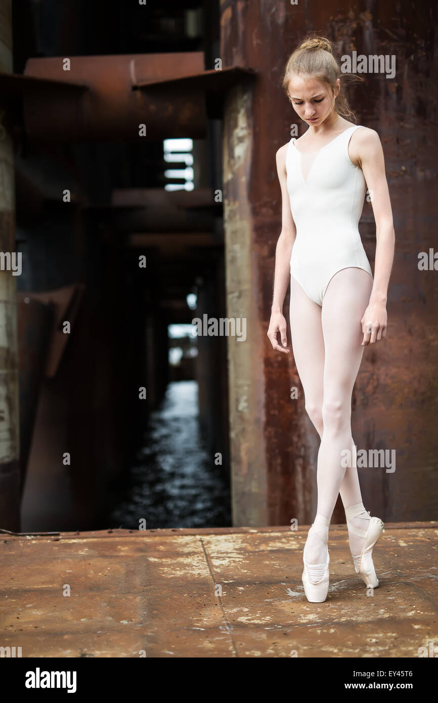 Graceful ballerina on pointe against a urban background Stock Photo