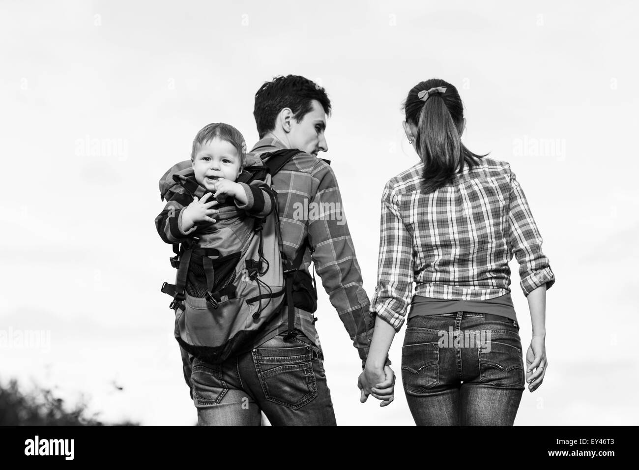 Baby boy in backpack Stock Photo Alamy