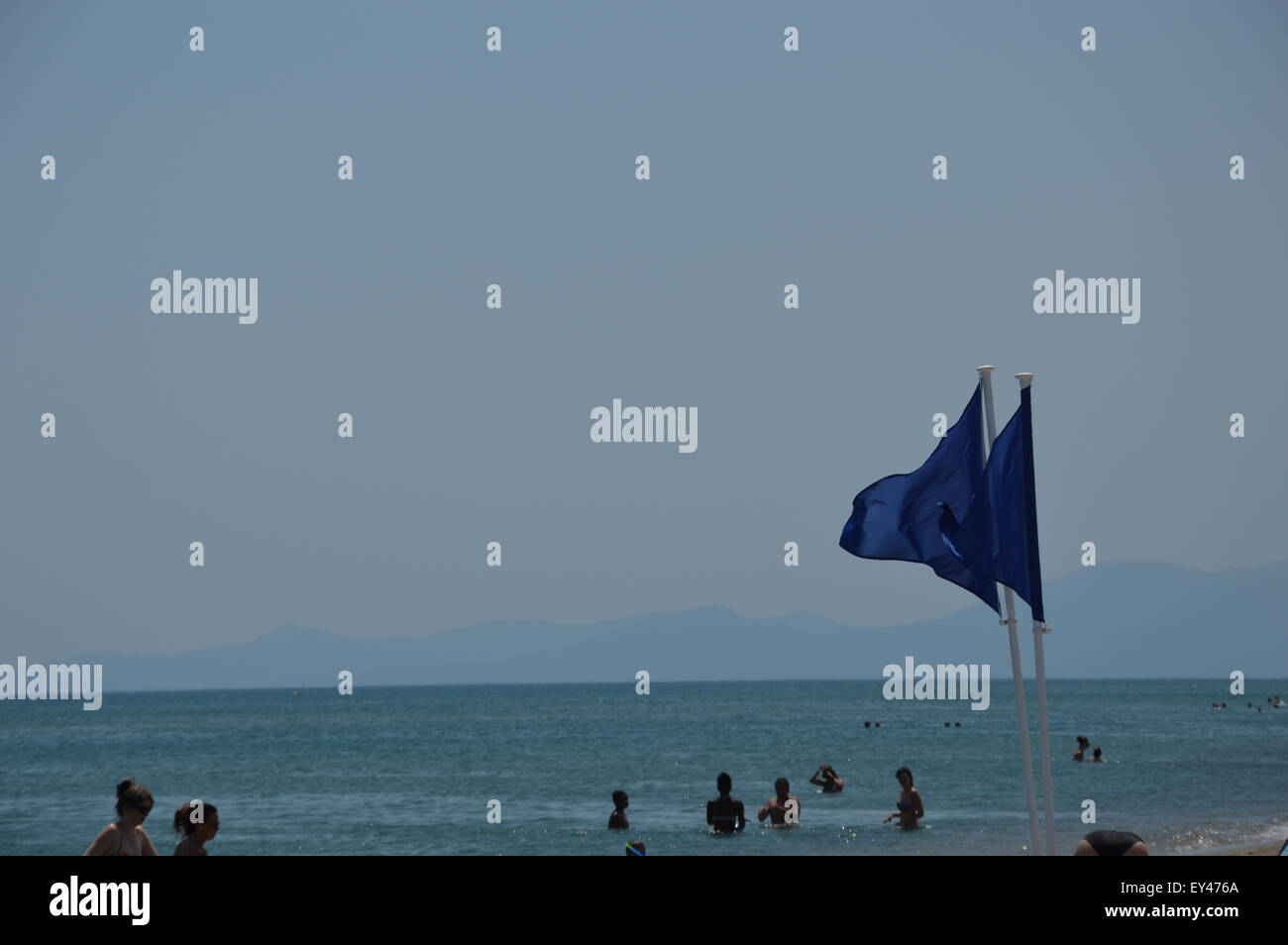 Flags on the beach Stock Photo Alamy