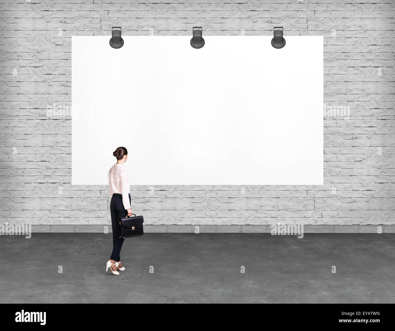Elegant business woman looking at banner. Stock Photo