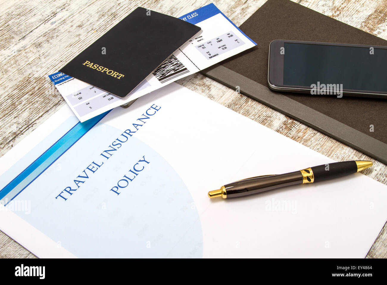 Travel Insurance Policy Booklet With A Boarding Pass And A Passport