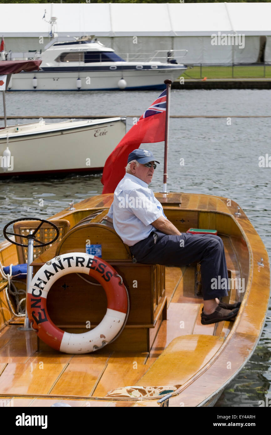 Man Sitting on a Traditional wooden Slipper launch on the River Thames