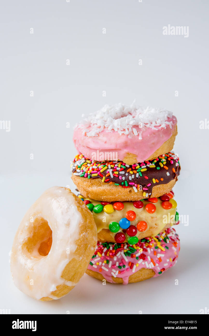 Stack of Assorted Decorated Doughnuts Stock Photo