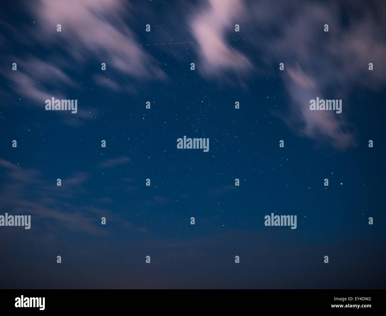 Cloudy sky with moon and stars at night Stock Photo - Alamy