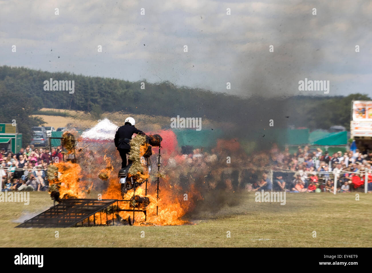 Royal corps of signals white helmet motorcycle display team 750 cc Triumph TR7V Tiger Motorcycles Jumping through Fire Stock Photo
