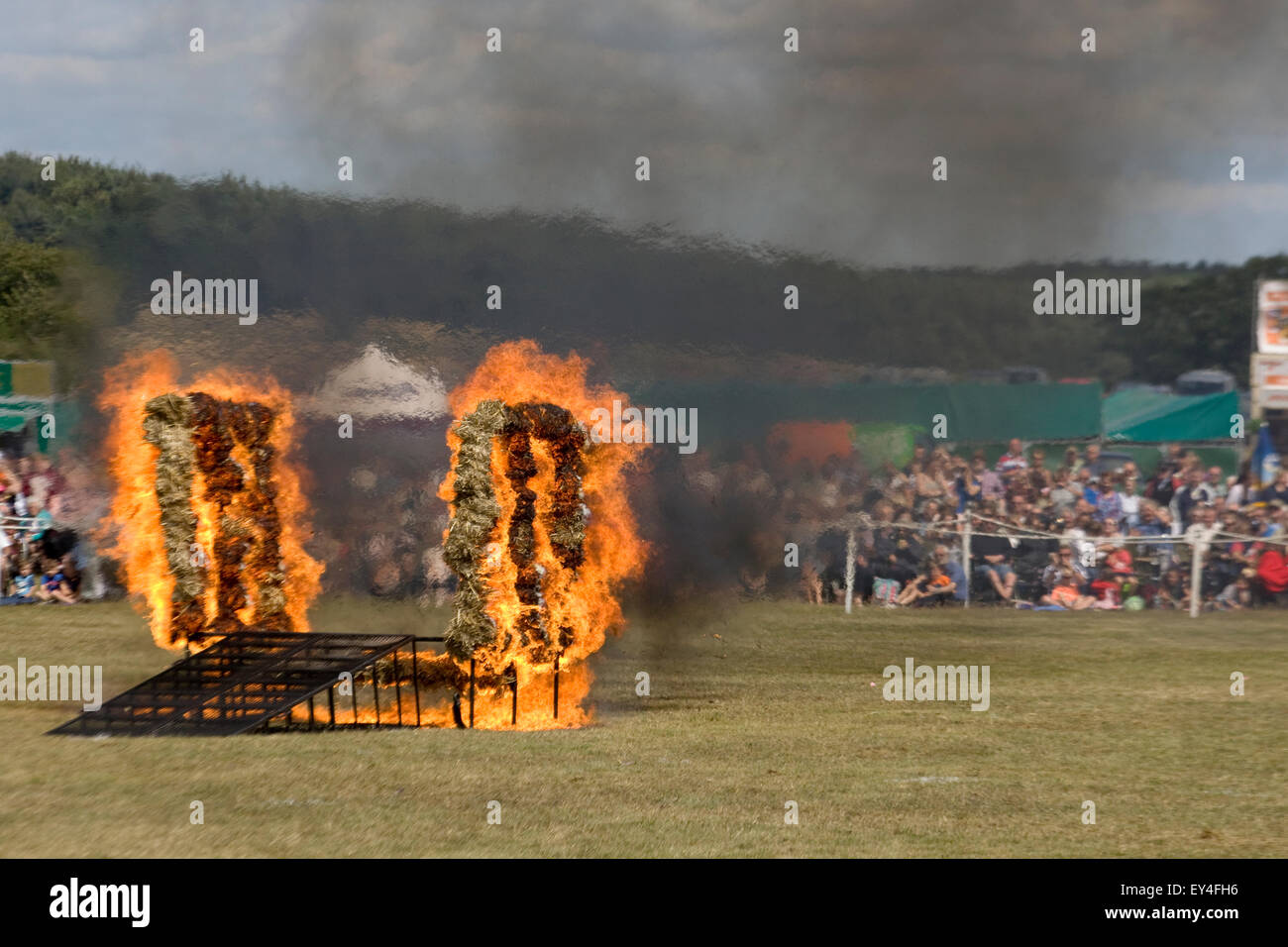 Royal corps of signals white helmet motorcycle display team 750 cc Triumph TR7V Tiger Motorcycles Jumping through Fire Stock Photo