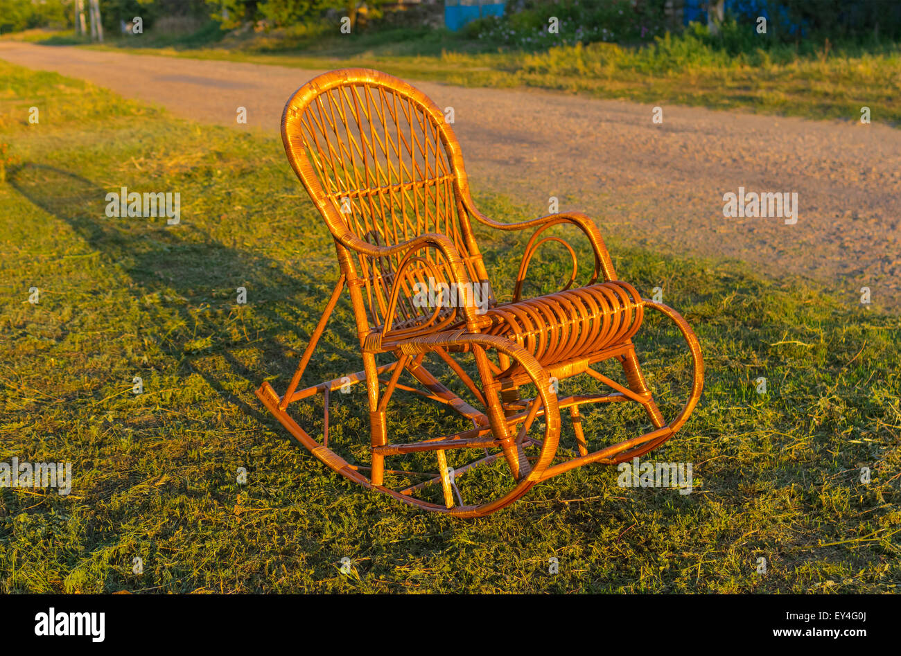 Wicker rocking-chair is waiting for the holiday-maker Stock Photo