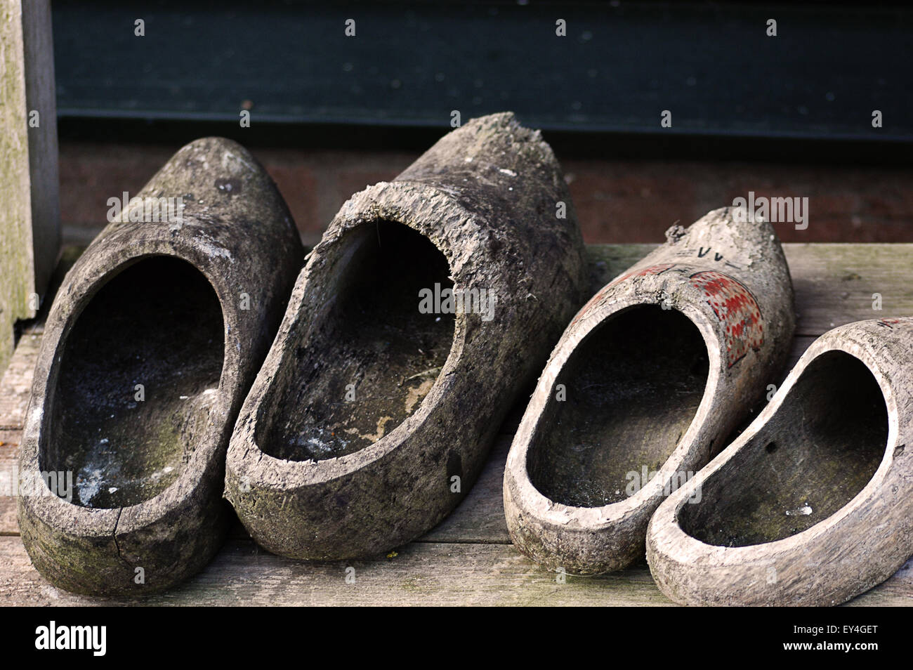 two pairs of Dutch clogs worn Stock Photo Alamy