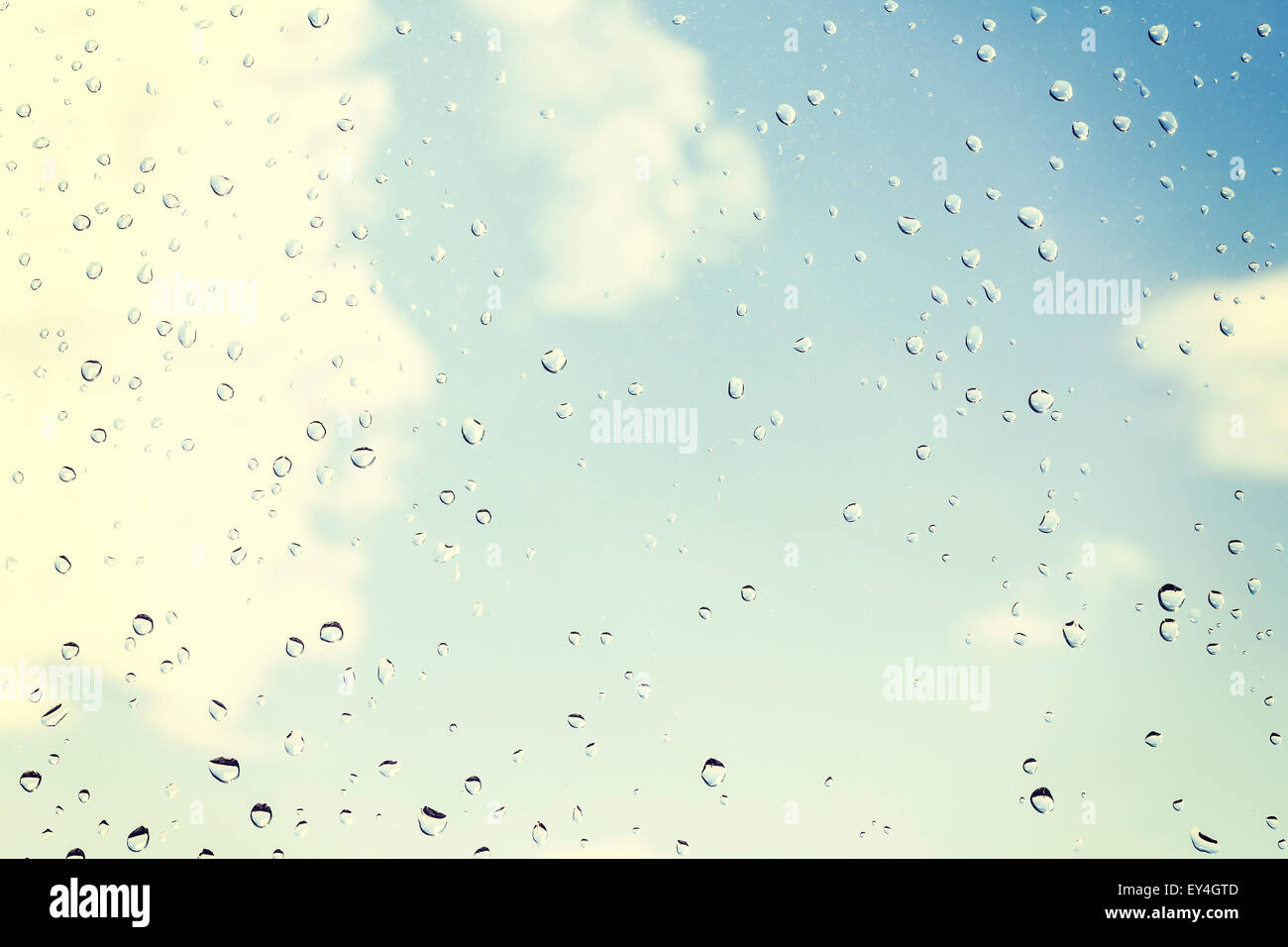 Drops of rain on glass, natural background. Stock Photo