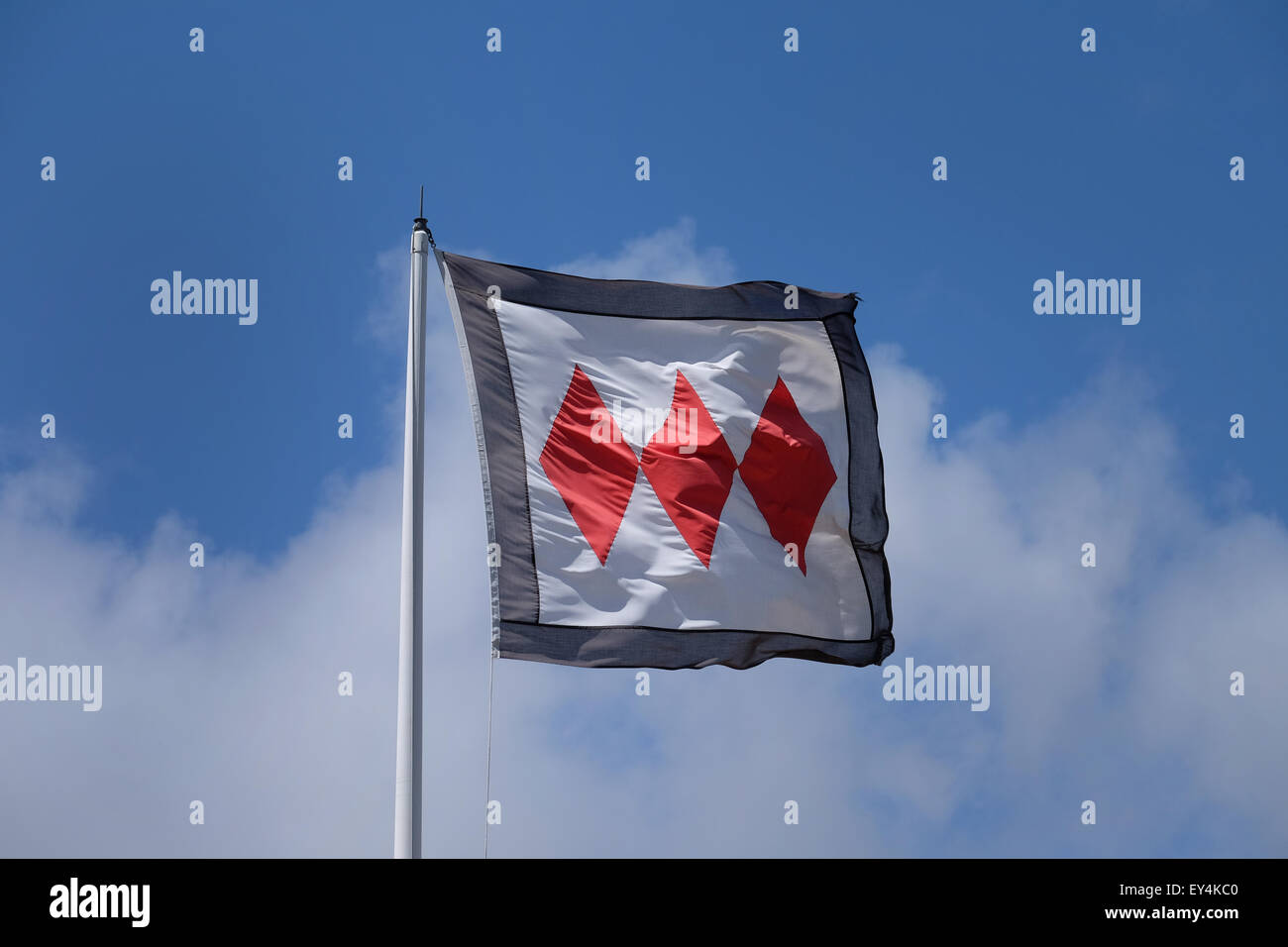 Three red diamonds Montagu coat of arms flag flying at Buckler's Hard on the Beaulieu Estate Stock Photo