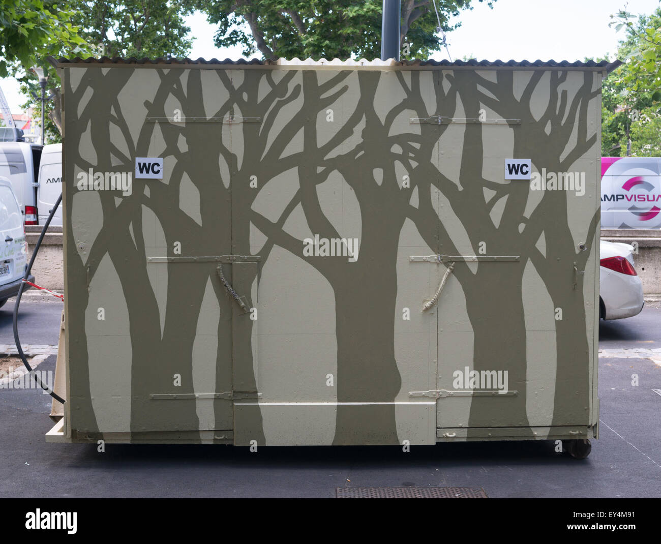 A camouflaged portable public toilet or WC seen in Béziers, France, Europe Stock Photo