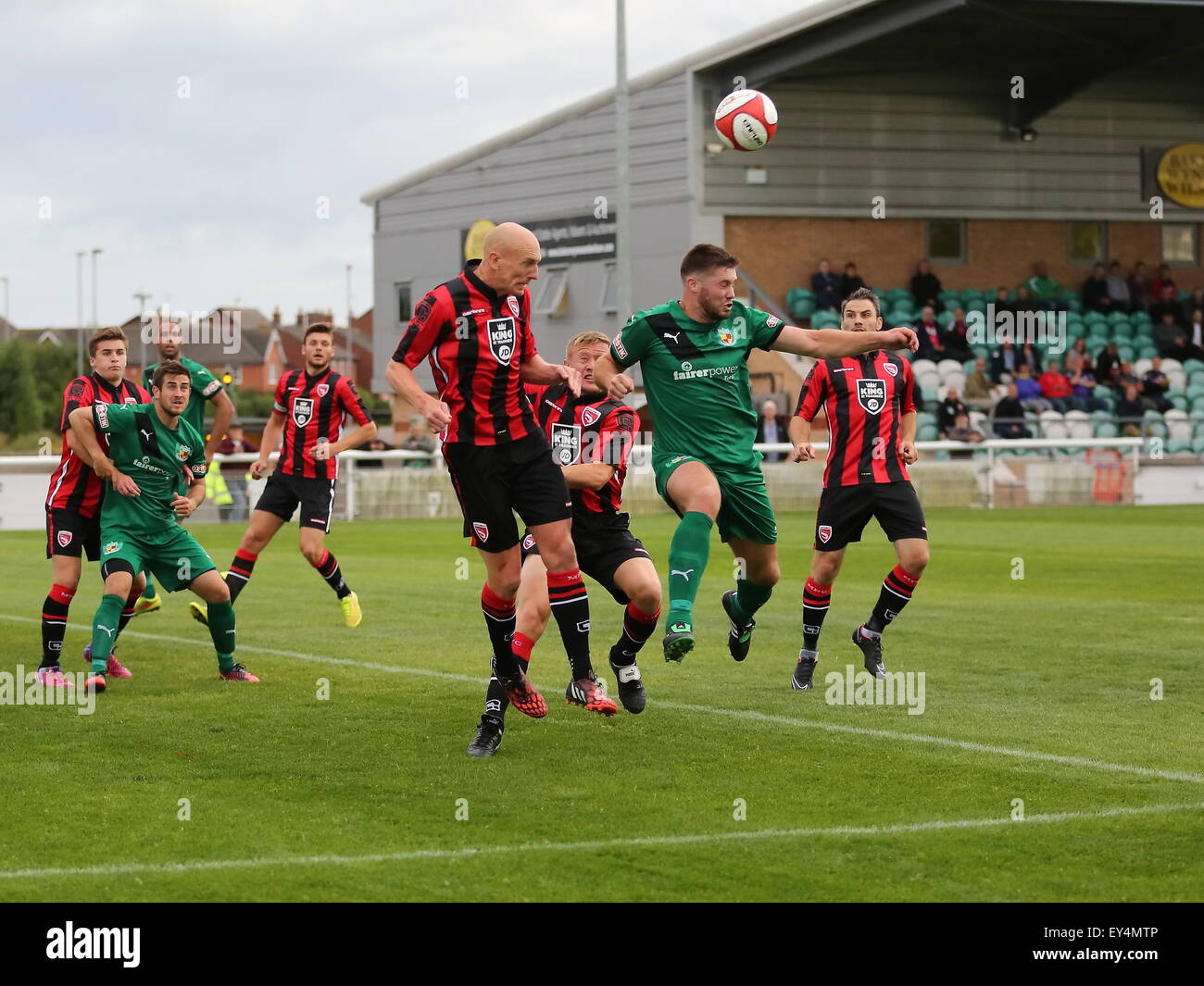 Nantwich, Cheshire, UK. 21st July, 2015. Nantwich Town entertain League Two Morecambe in a pre season friendly at The Weaver Stadium. Morecambe ran out 6-0 victors.Nantwich Town's Ben Mills heads the ball in the Morecambe area. Credit:  SJN/Alamy Live News Stock Photo