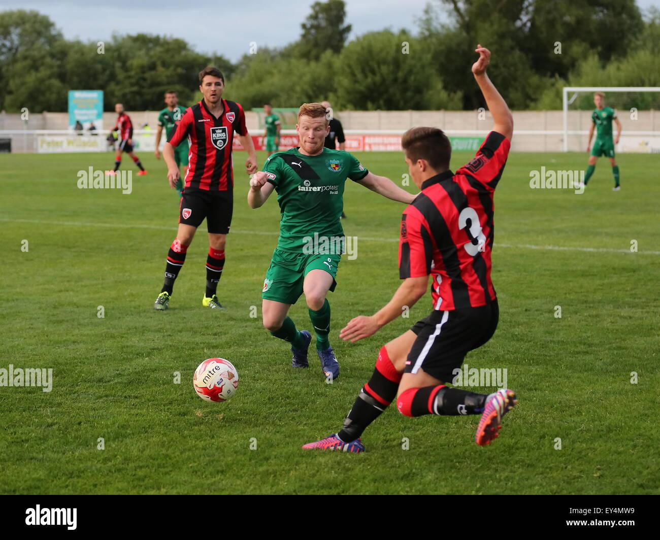 Nantwich, Cheshire, UK. 21st July, 2015. Nantwich Town entertain League Two Morecambe in a pre season friendly at The Weaver Stadium. Morecambe ran out 6-0 victors. Nantwich Town's Chris Smith closes in on Morecambe's Aaron McGowan. Credit:  SJN/Alamy Live News Stock Photo