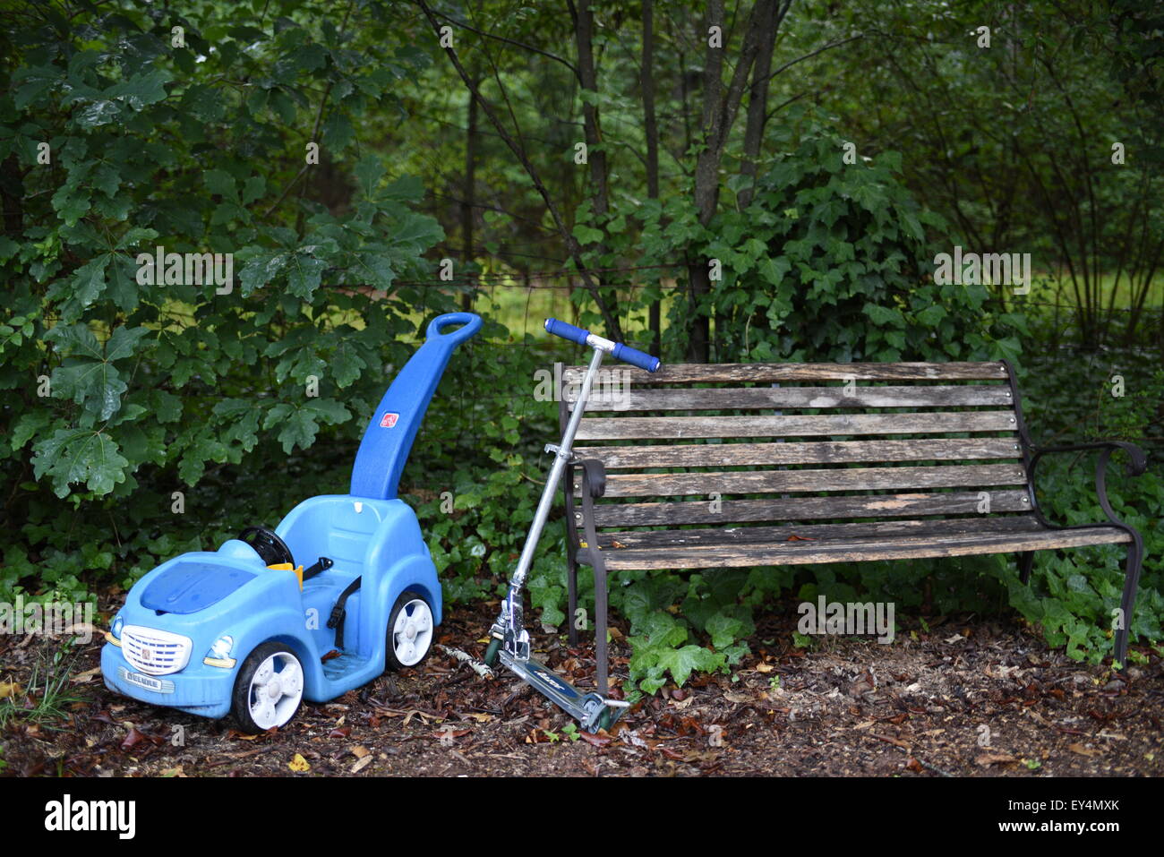 Kids Toys Left In The Yard And A Park Bench Stock Photo 85541419