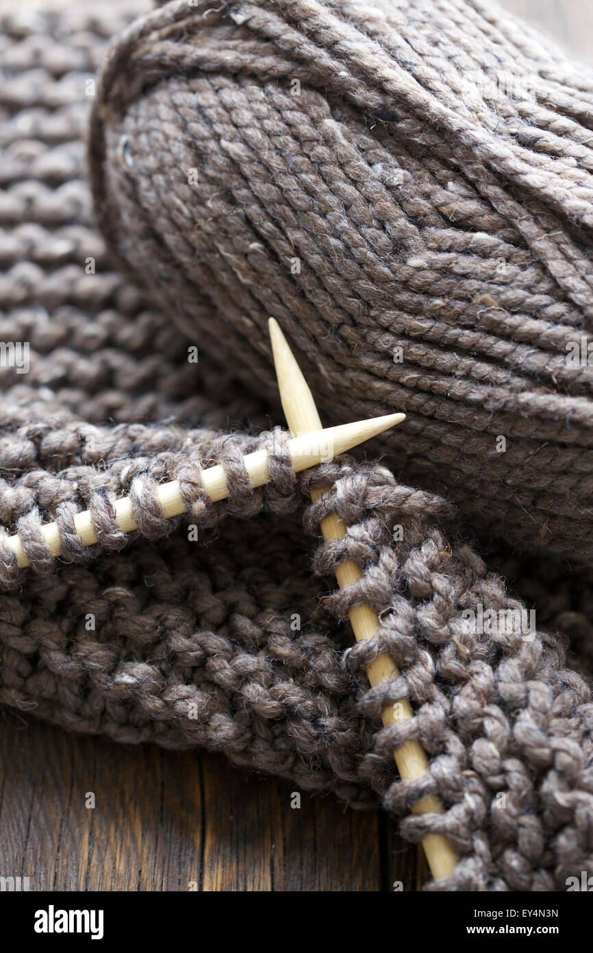 Close up image wooden knitting needles and brown chunky wools Stock Photo