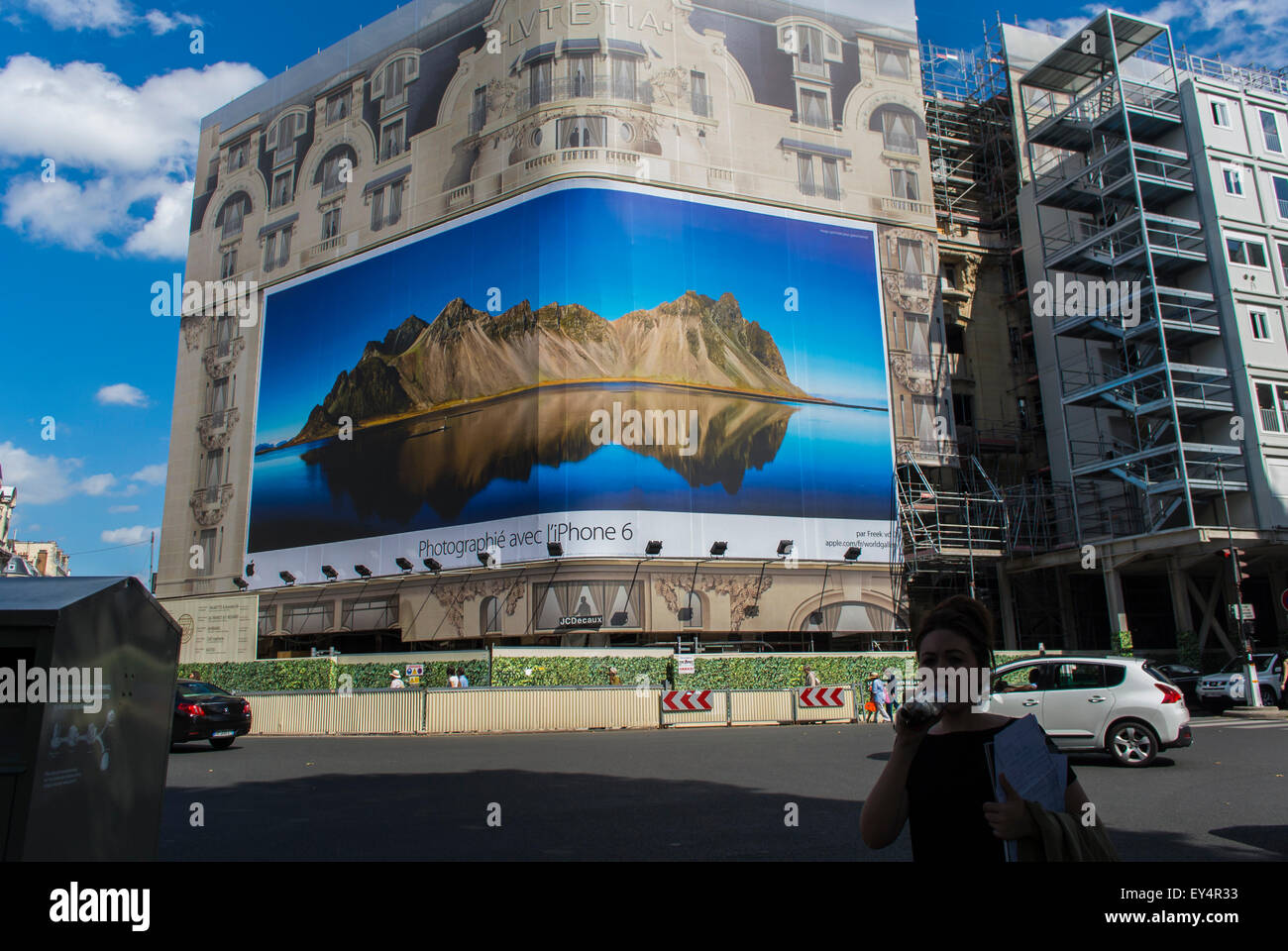 Paris, France, French Luxury Hotel, Lutetia, Under Renovation, with Large Outdoor International Advertising campaign for Apple Iphone, commercial ad, Billboard, france advertising Stock Photo