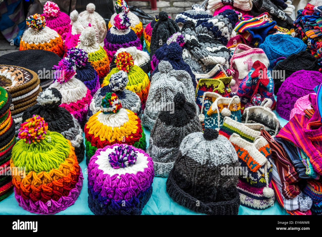 Colorful hand-knitted beanie hats for sale at local market. Otavalo, Ecuador. Stock Photo