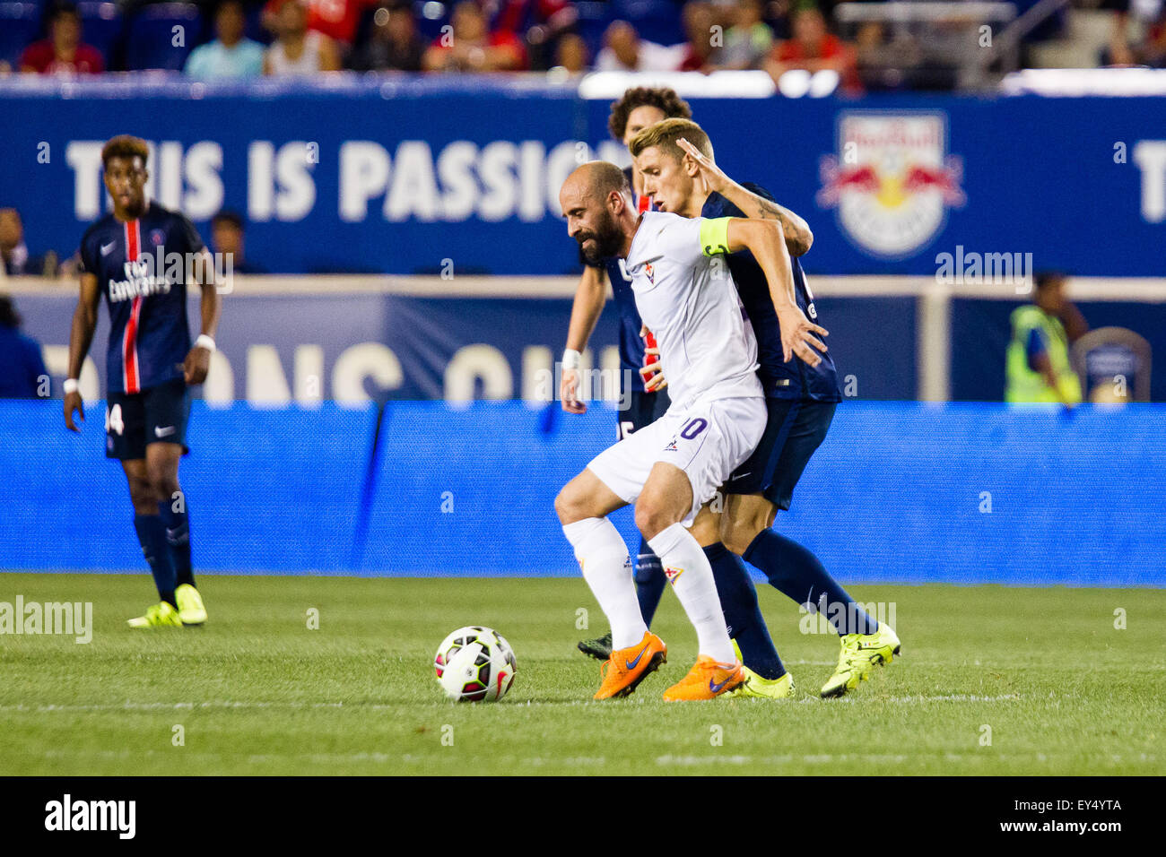 July 21, 2015: Fiorentina midfielder Alberto Aquilani #10 works the ball in front of Paris Saint-Germain defender Lucas Digne #21 during the International Champions Cup featuring Paris Saint-Germain versus Fiorentina (AFC) at Red Bull Arena in Harrison, NJ. Stock Photo