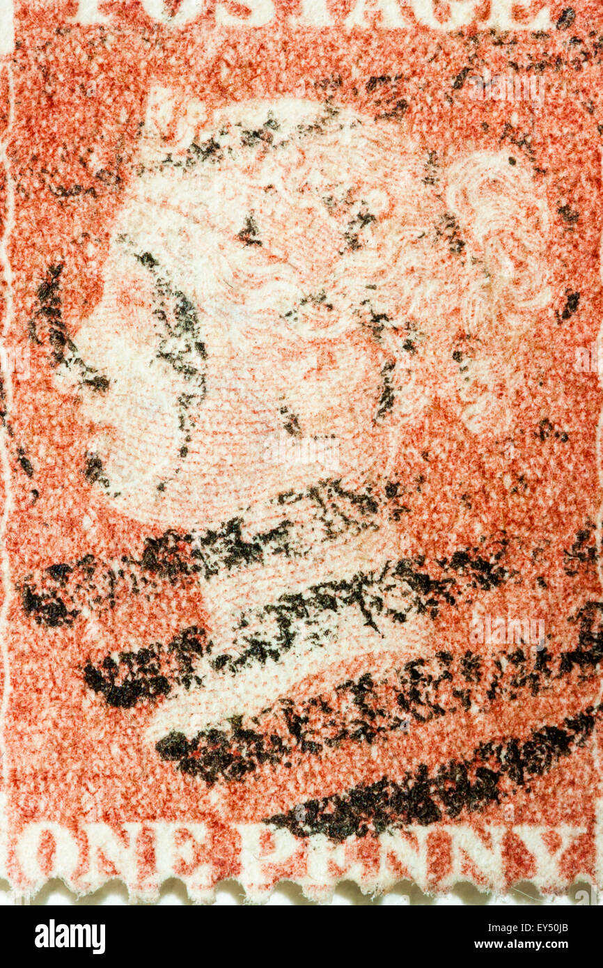 Close up of a British penny red Victorian stamp, cancelled, franked with an oval postmark. Stock Photo