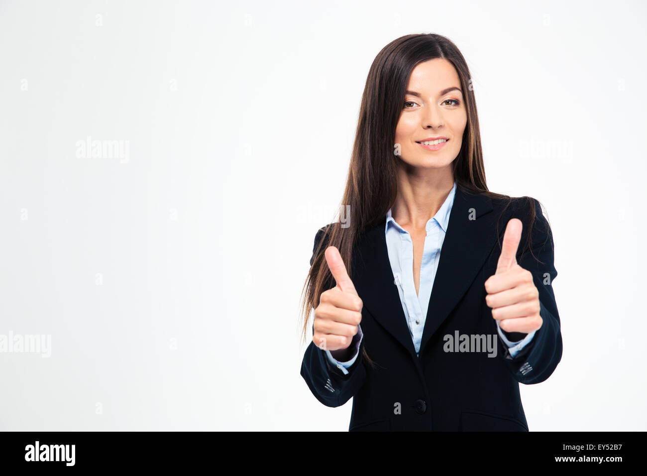 Smiling beautiful businesswoman showing thumbs up isolated on a white ...