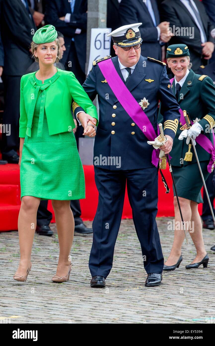 Belgian Prince Laurent (L) is pictured with Princess Claire (R) and her  daughter Princess Louise on the podium during the military parade on the  occasion of Belgium?s National Day in Brussels, Belgium