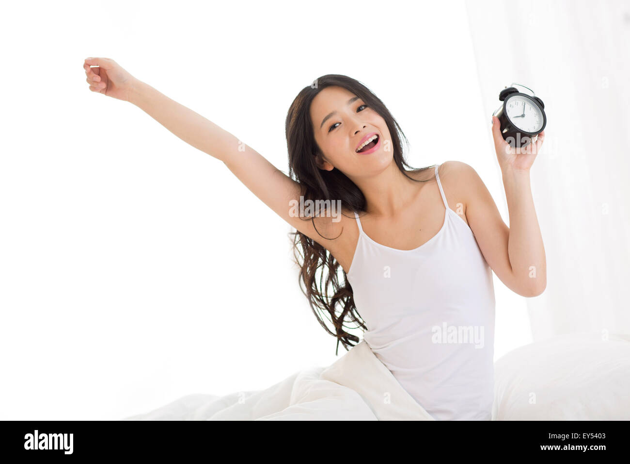 Beautiful young woman wake up Stock Photo Alamy