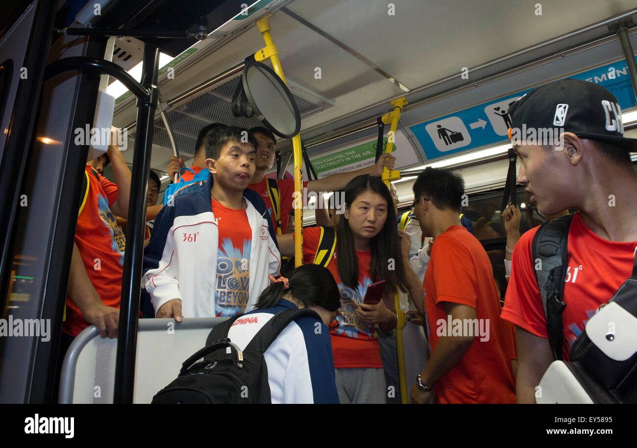 Los Angeles, USA. 21st July, 2015. Chinese national team for 2015 Special Olympics World Summer Games get on the shuttle bus at the Los Angeles International Airport in California, the United States, July 21, 2015. Due to the transportation failure of the Organizing Committee of 2015 Special Olympics World Summer Games, a lot of teams arriving at the airport stranded for a long time. Chinese national team got to leave the airport at 23:55 after nealy 4 hours waiting. © Yang Lei/Xinhua/Alamy Live News Stock Photo