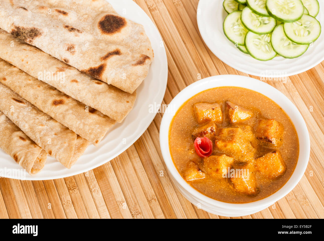 Folded homemade wheat chapati (Indian bread) served with delicious