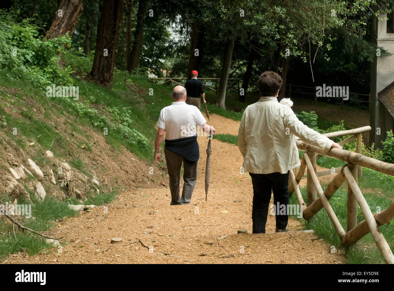 elderly people walking in a park, Italy Stock Photo