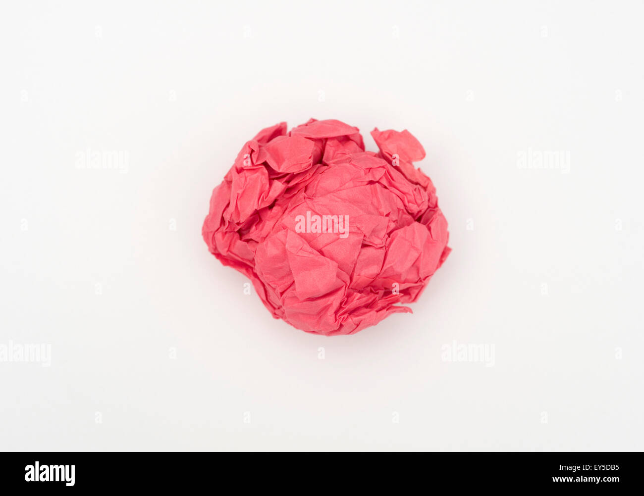 crumpled ball of red paper Stock Photo