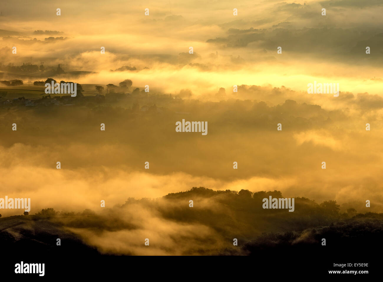 Mists of Savoyard countryside at dawn - France after a stormy night Stock Photo
