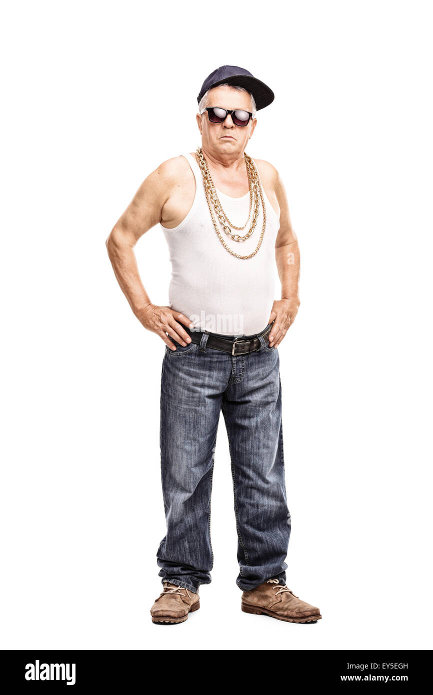 Full length portrait of a senior man in hip-hop clothes looking at the camera isolated on white background Stock Photo