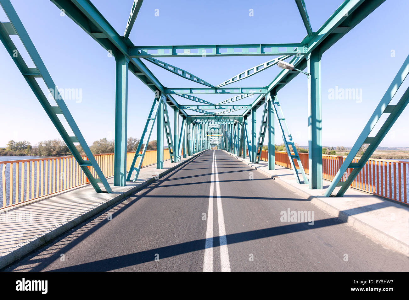 Photo of a long steel bridge over a river, Gryfino in Poland. Stock Photo