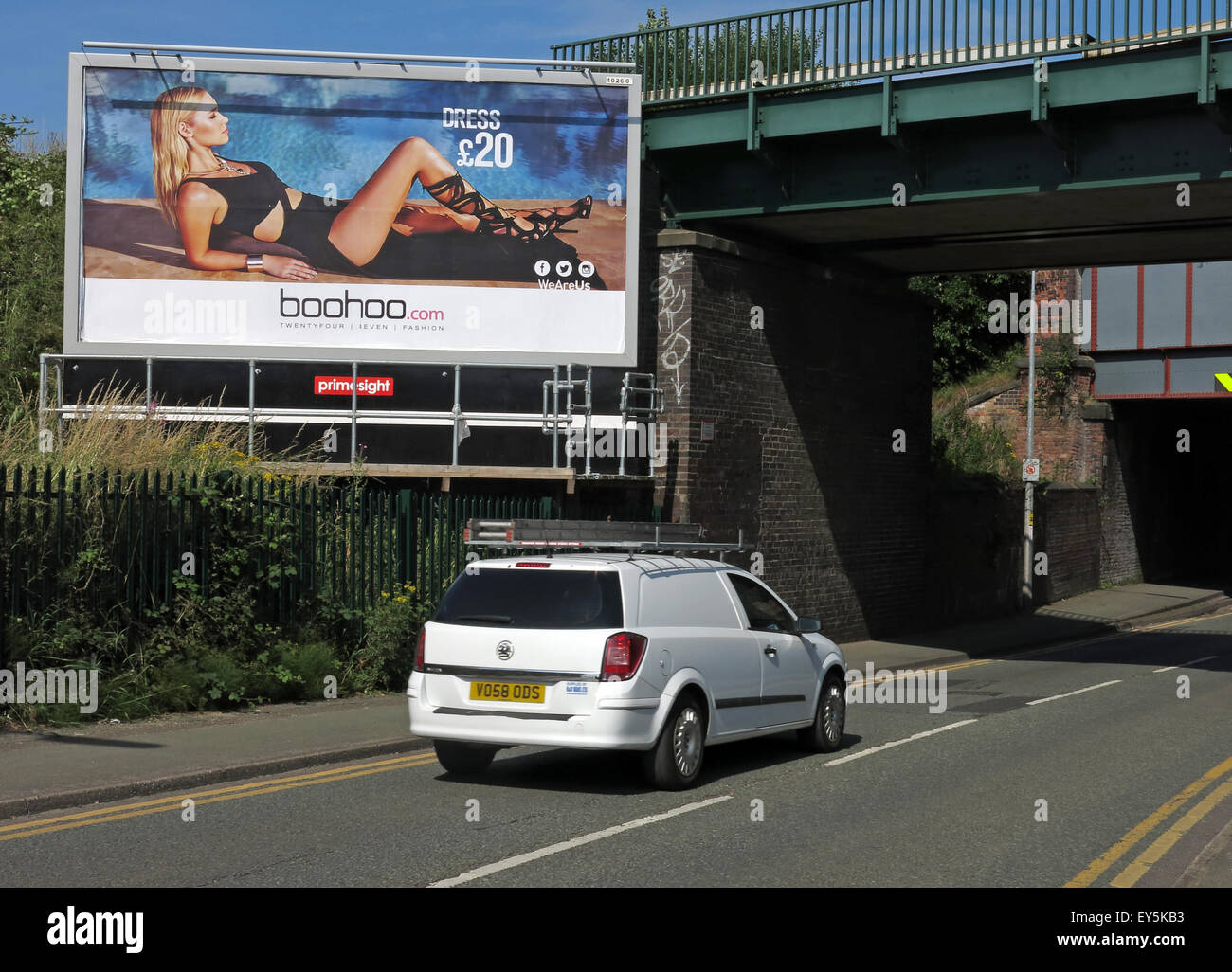 Woman on poster distracting drivers on the road, Warrington England, UK - Boohoo online clothing advert Stock Photo