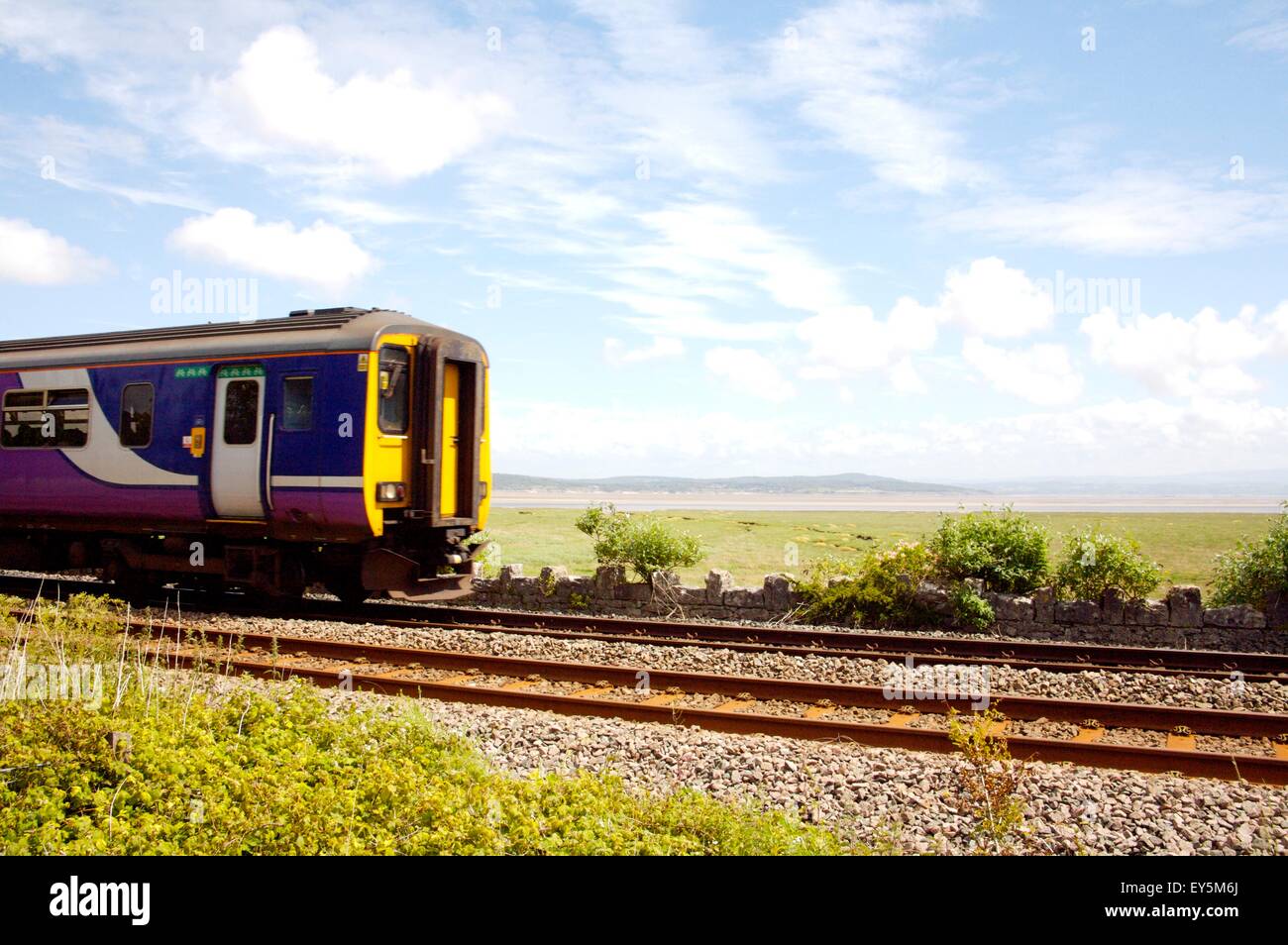 Transpennine train on line between Carnforth and Silverdale, Cumbria Stock Photo