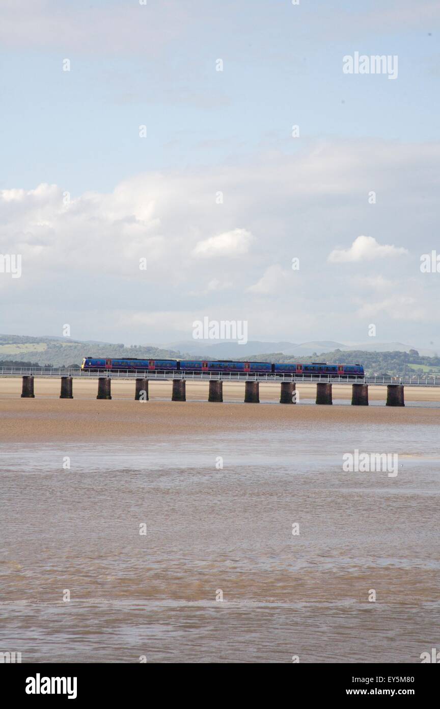 train crossing Kent estuary between Arnside and Grange over Sands, Cumbria, England. Stock Photo
