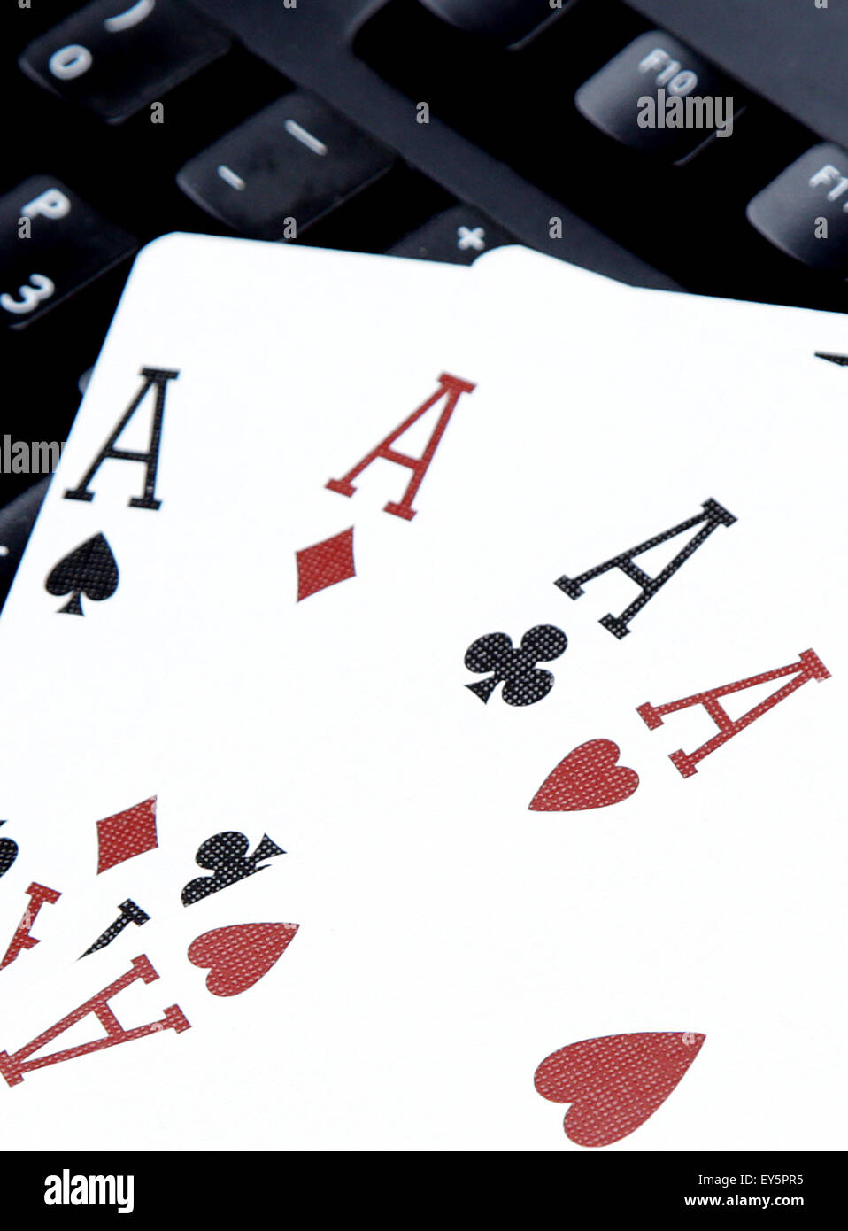 internet casino poker four of kind aces cards comdination hearts on keyboard Stock Photo