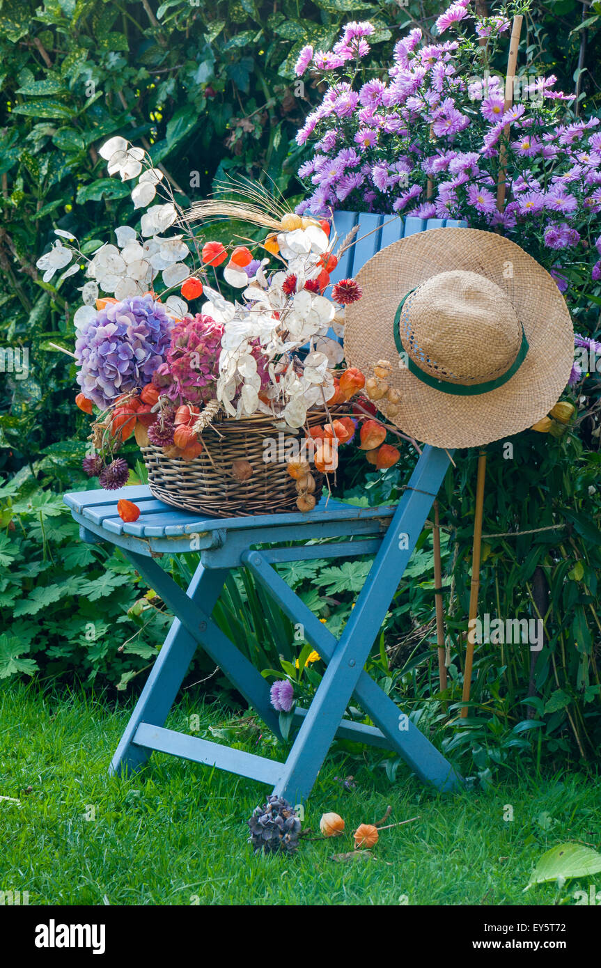 Bouquets on a decorative garden chair Stock Photo