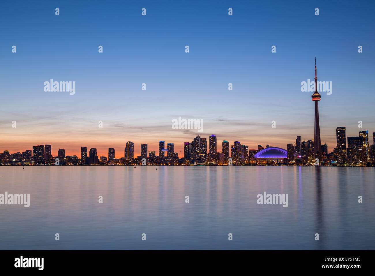 A view of buildings West of Downtown at dusk from Lake Ontario with copy space above or below the buildings Stock Photo