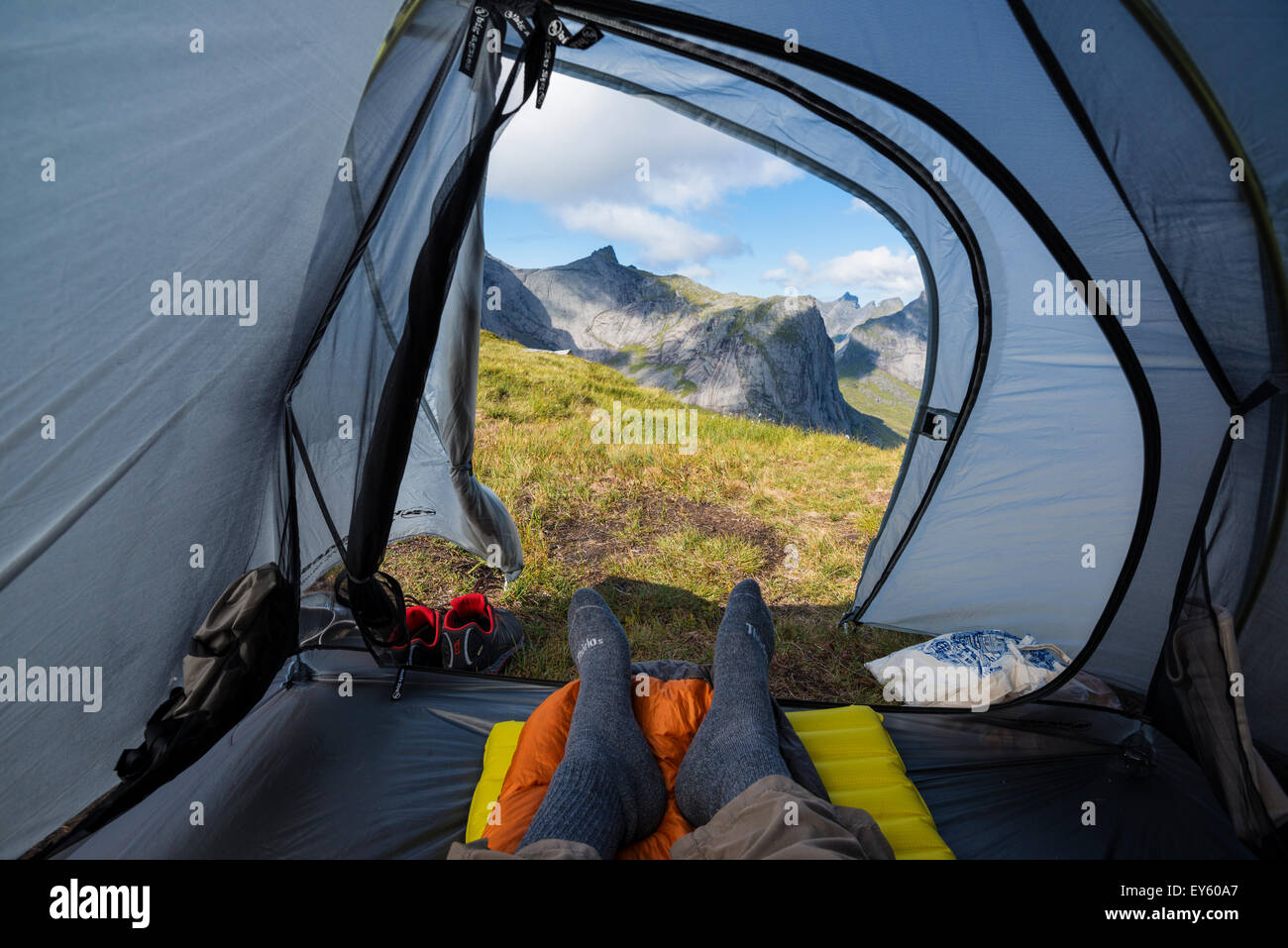 Looking out door of tent across mountain landscape, Moskenesøy, Lofoten Islands, Norway Stock Photo