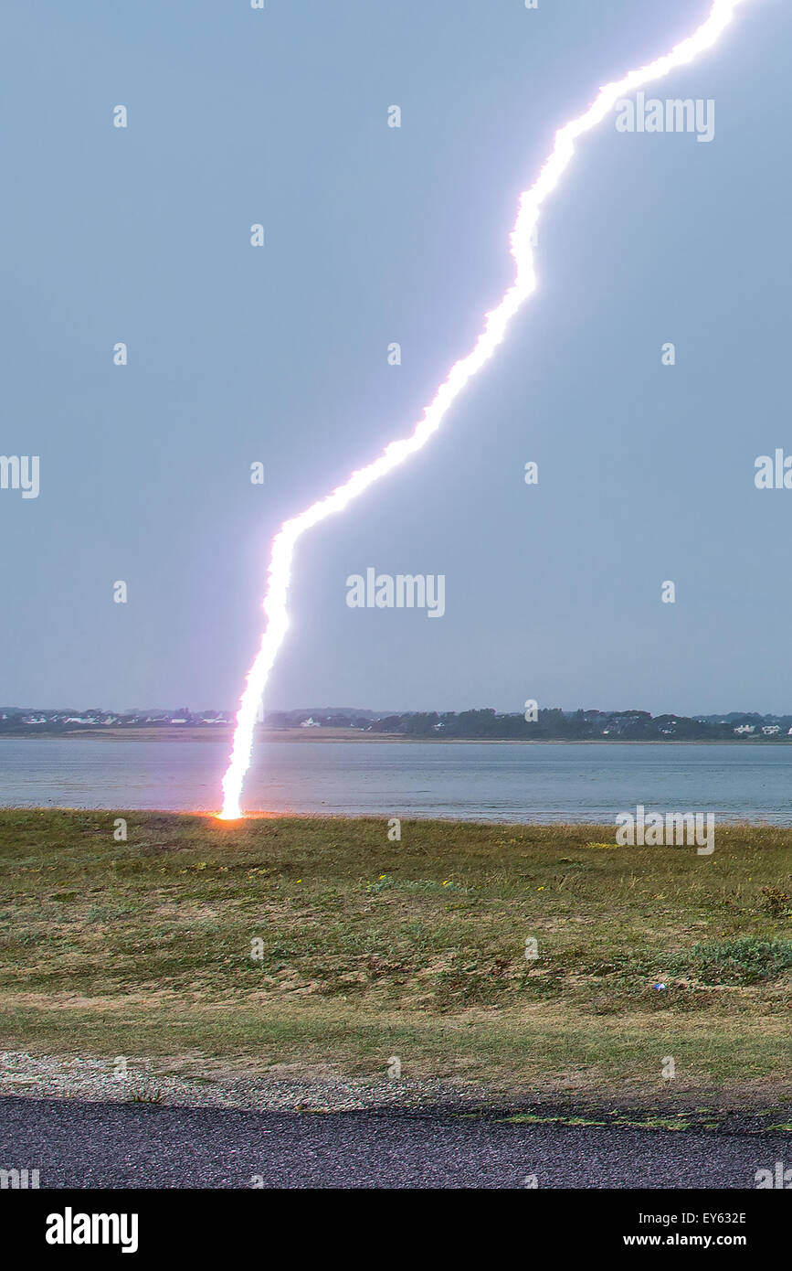 Lightning strike on the shore in summer - Brittany France impact of lightning  strikes sand dunes 50 meters of the photographer Stock Photo - Alamy