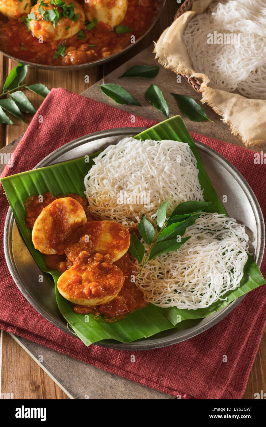 Egg curry and string hoppers. Sri Lanka and South India Food Stock Photo