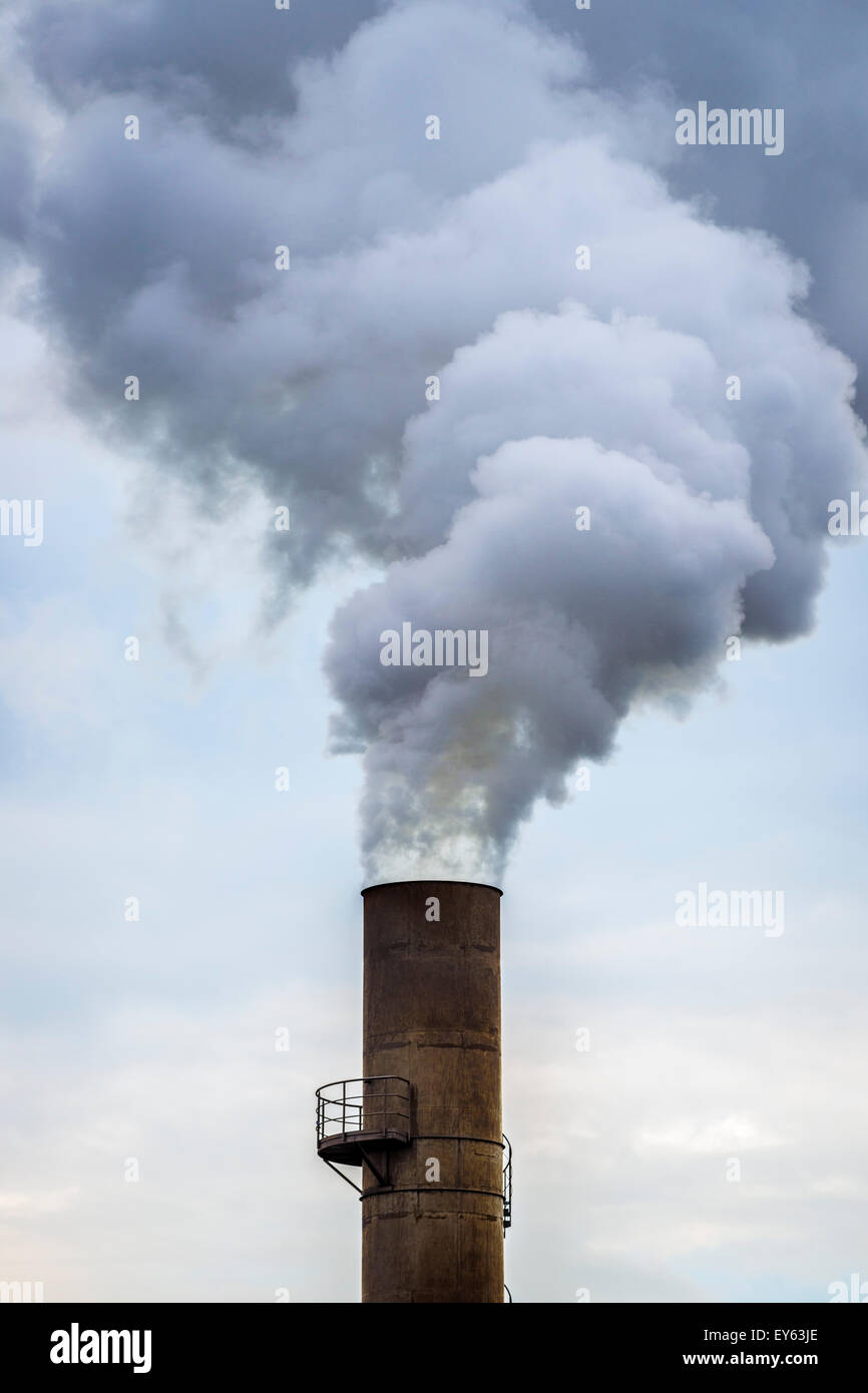 Smoke from industrial chimney stack Stock Photo