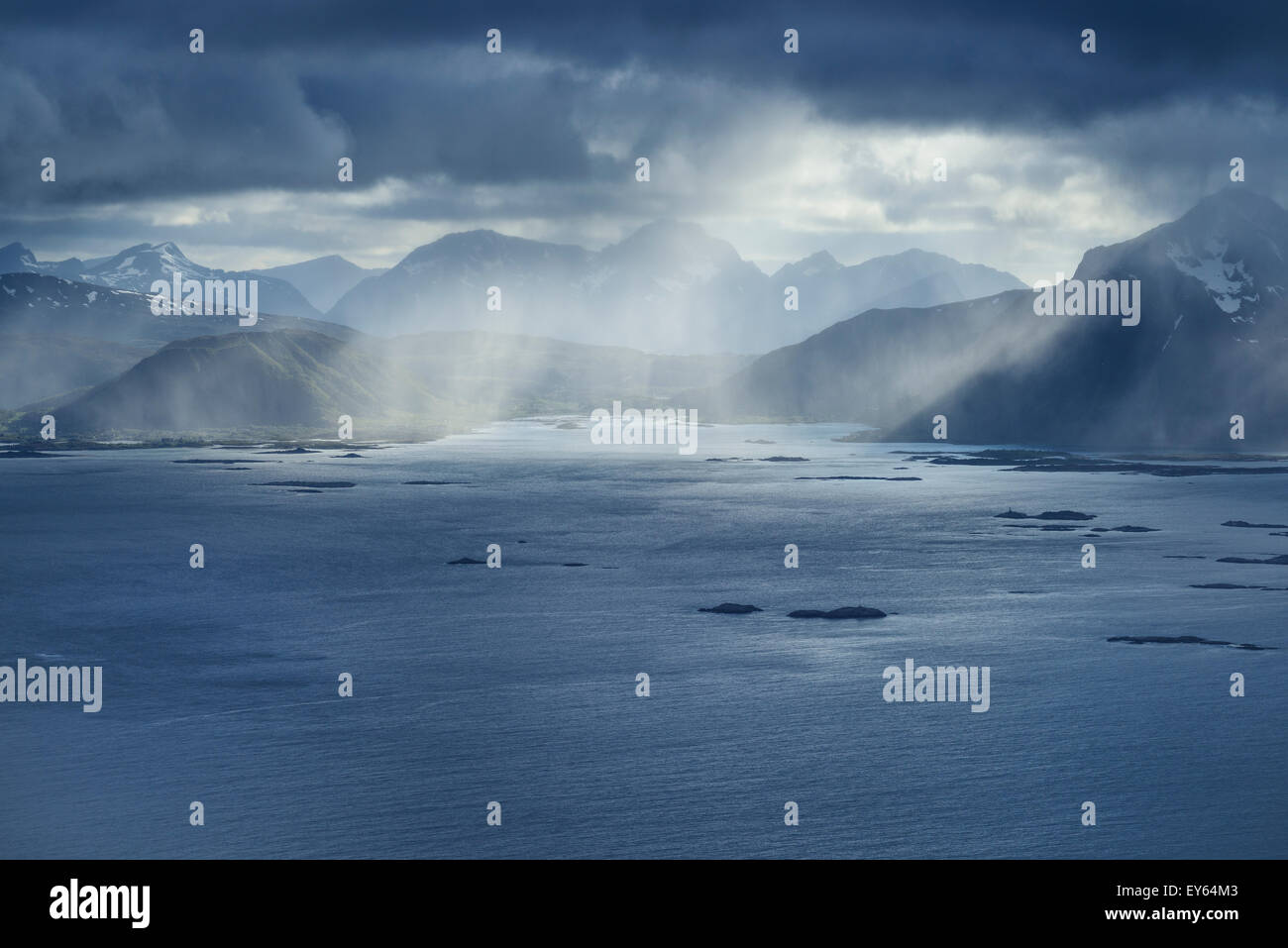 Summer snow flurries approach over sea, Austvågøy, Lofoten Islands, Norway Stock Photo